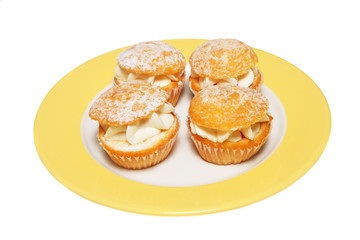 Four butterfly buns on a plate