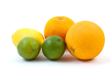 Oranges, limes and lemon isolated on the white background