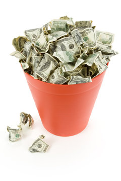 Dollars in Red Garbage Can with White Background