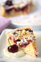 Cherry tart or pie, with fresh cream.