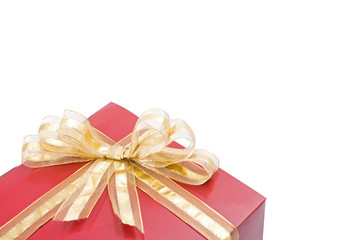 Red gift with a golden bow isolated on white background