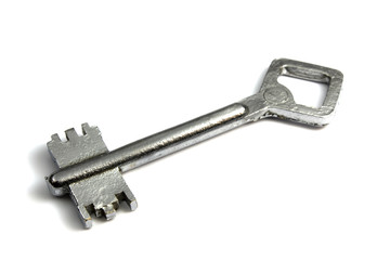 Old-fashioned chromeplated key on a white background