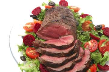 roast sliced red meat and vegetables