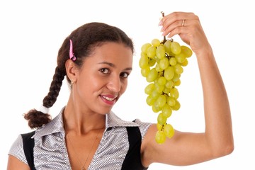 beautiful girl with green grapes on a white background