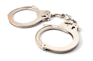 police handcuffs isolated on a white background - obrazy, fototapety, plakaty