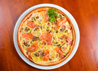 tomato pizza on plate.Italian kitchen.Close-up