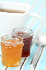 cup of delicious tea with sweet confiture