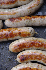 a sausage grilled on a camp fire