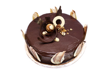 A dark chocolate cake isolated over white background.