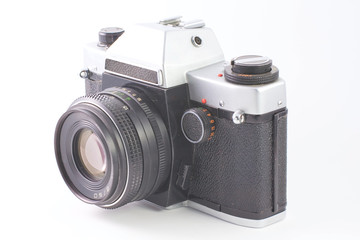 Old SLR camera isolated on white background