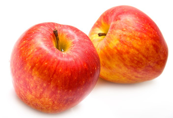 The ripe red apples on white. Isolation, shallow DOF.