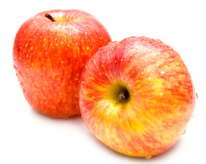 The wet red apples on white. Isolation, shallow DOF.