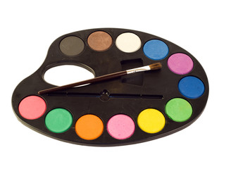 A painters palette and brush isolated on a white background