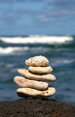 White coral rocks stacked by a meditating zen follower