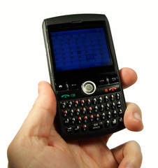 male hand holding pda/black berry/mobile phone