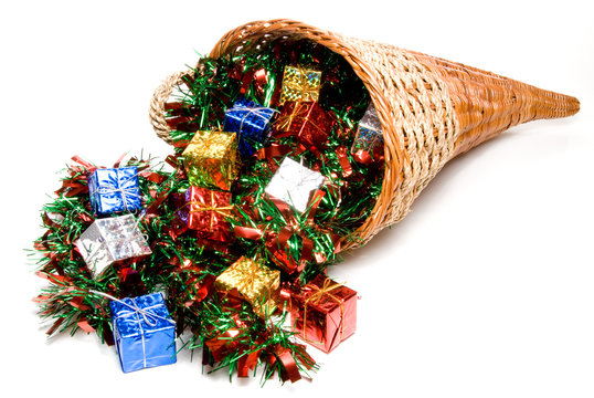 A cornucopia filled with holday Christmas presents.