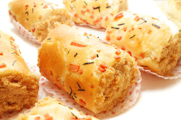 Close up of many chicken floss scroll bun.