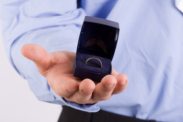 young man presenting engagement ring