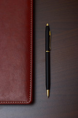 Business style: daily with leather cover and a black pen