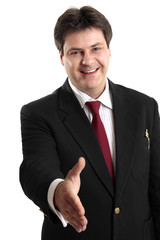 Businessman extends his hand to seal a deal or in greeting