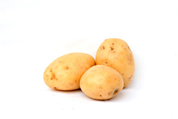 Three potatoes isolated on white background