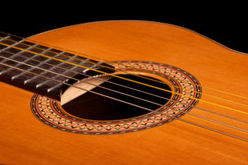 Obraz premium Classical guitar close up on dark background