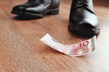 money on a wooden floor