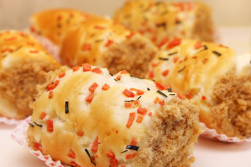 Close up of many chicken floss scroll bun.