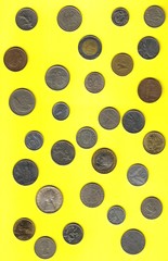 miscellaneous before euro coins on yellow background
