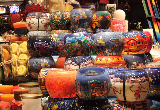 A Christmas Market Stall Selling Candles.