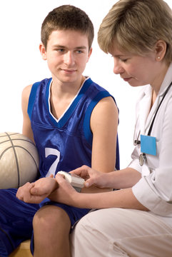 Doctor Checks A Blood Pressure At The Young Sportsman