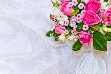 beautiful wedding backround with pink roses and white dress