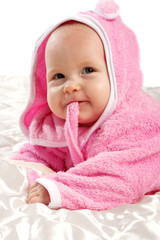 Baby in pink after bath, isolated