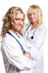 Friendly young doctors smiling over a white background