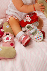 baby girl and shoes