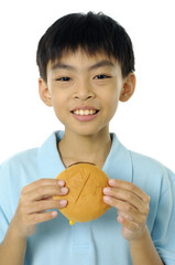 Asain kids eating A Burger