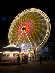 big wheel and carousel at night