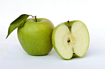 Green apple and section isolated on white background