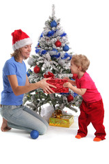 Mum gives a gift to the daughter for Christmas