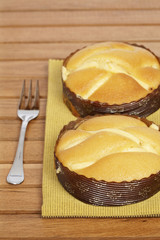 Two tasty cakes on wooden background. Shallow DOF
