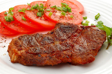 Grilled steak with vegetable salad isolated on white