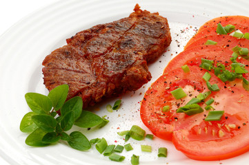 Grilled steak with vegetable salad isolated on white