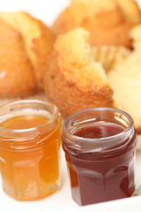 fresh muffins and jars of delicious jam - sweet dessert