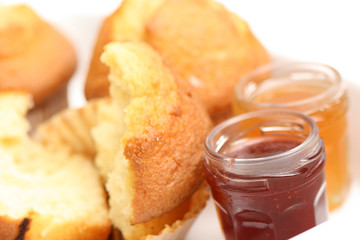 fresh muffins and jars of delicious jam - sweet dessert