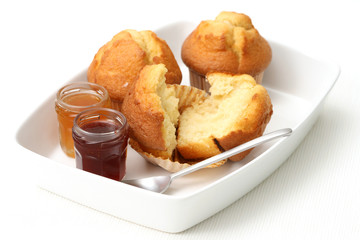 fresh muffins and jars of delicious jam - sweet dessert