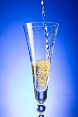 Champagne poured in to the glass