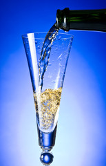 Champagne poured in to the glass
