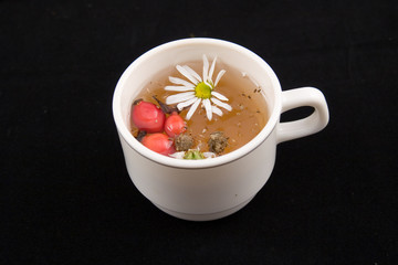 medicinal decoction with hips and flowers of chamomile