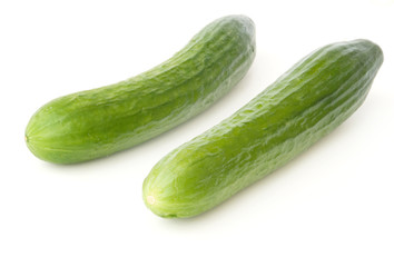 Two cucumbers isolated on white background