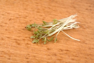 Fresh, healthy green crees over bread-board.